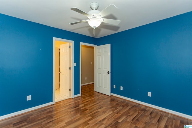 unfurnished bedroom with hardwood / wood-style flooring and ceiling fan