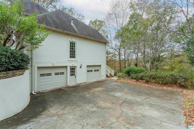 view of side of property featuring a garage