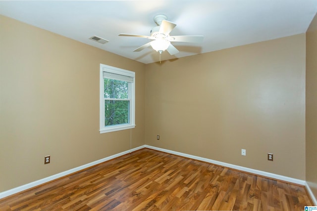 spare room featuring hardwood / wood-style flooring and ceiling fan