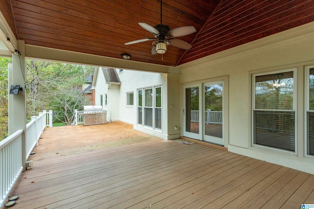 wooden deck featuring ceiling fan