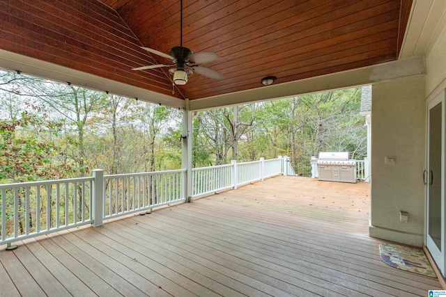 wooden deck with a grill and ceiling fan