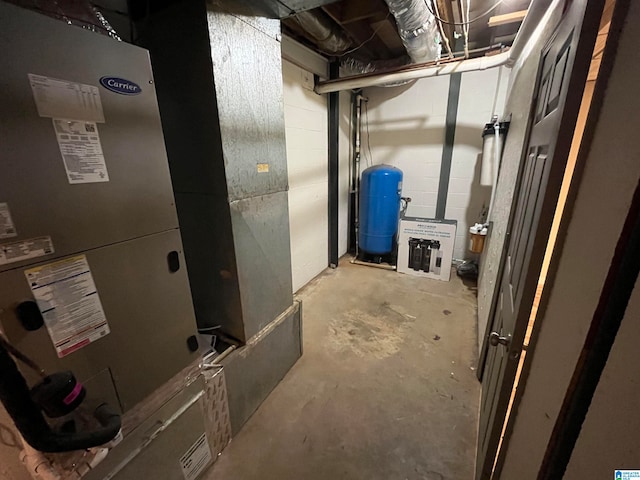 utility room featuring heating unit