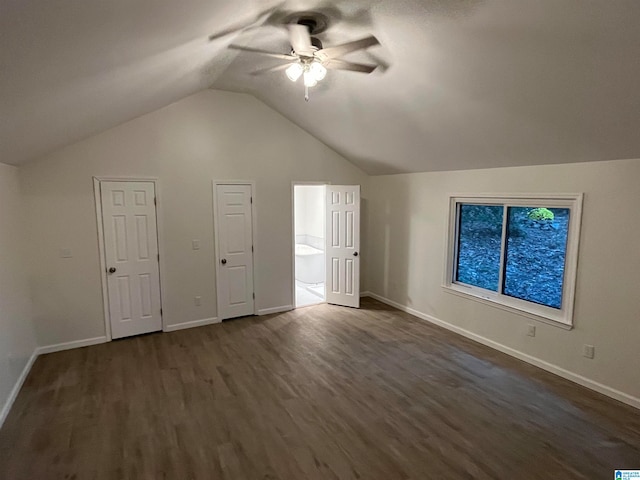 additional living space with lofted ceiling, ceiling fan, and dark hardwood / wood-style floors