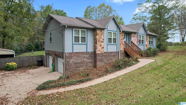 view of front of house with a front lawn and a garage