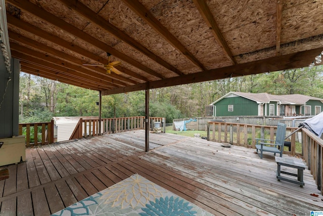 wooden deck featuring a trampoline and ceiling fan