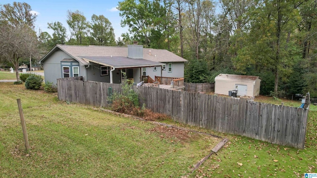 exterior space with a yard and a storage unit