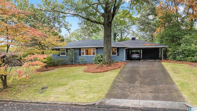 ranch-style home with a carport and a front lawn