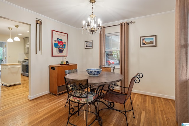 dining area featuring a wealth of natural light, an inviting chandelier, light hardwood / wood-style flooring, and ornamental molding