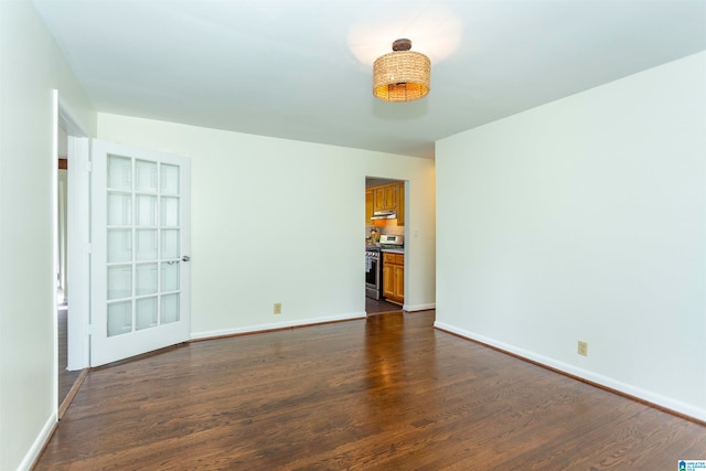 unfurnished room featuring dark hardwood / wood-style flooring