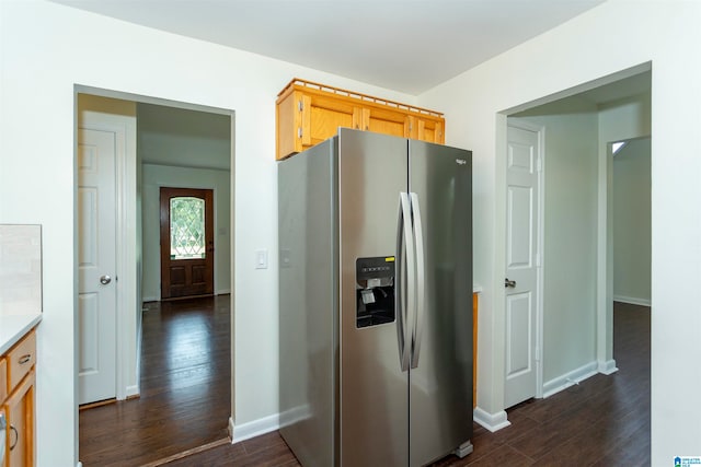 kitchen with dark wood-type flooring and stainless steel refrigerator with ice dispenser