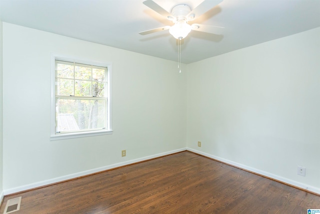 unfurnished room featuring ceiling fan and dark hardwood / wood-style floors