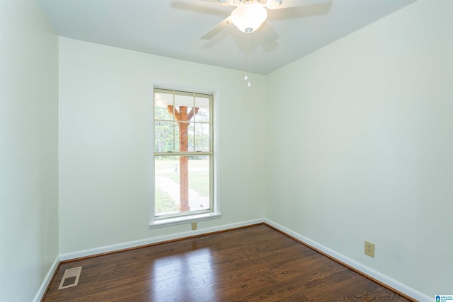 unfurnished room with ceiling fan and dark hardwood / wood-style floors