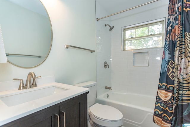 full bathroom with vanity, shower / bath combo with shower curtain, and toilet