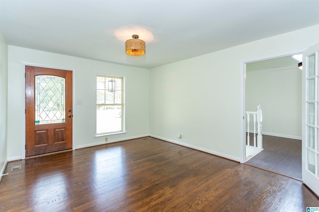 foyer entrance with dark hardwood / wood-style flooring