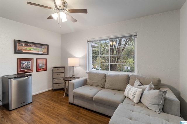 living room with hardwood / wood-style flooring and ceiling fan