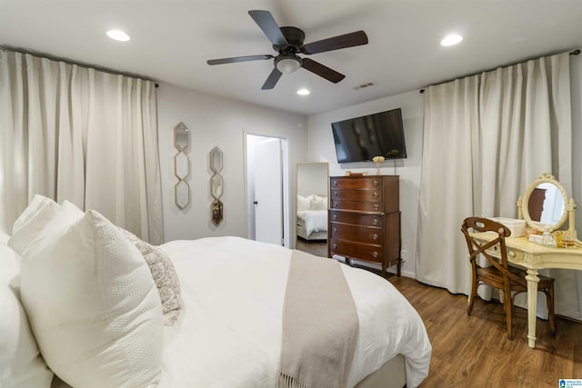 bedroom featuring ceiling fan and dark hardwood / wood-style floors