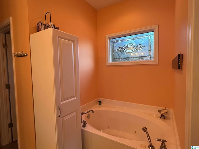 bathroom featuring a tub to relax in