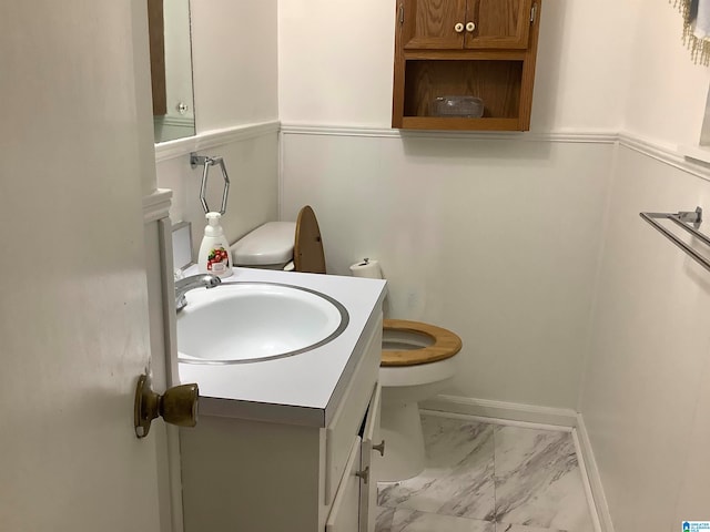 bathroom featuring toilet and vanity