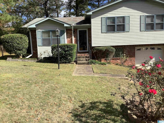 split level home featuring a garage and a front lawn