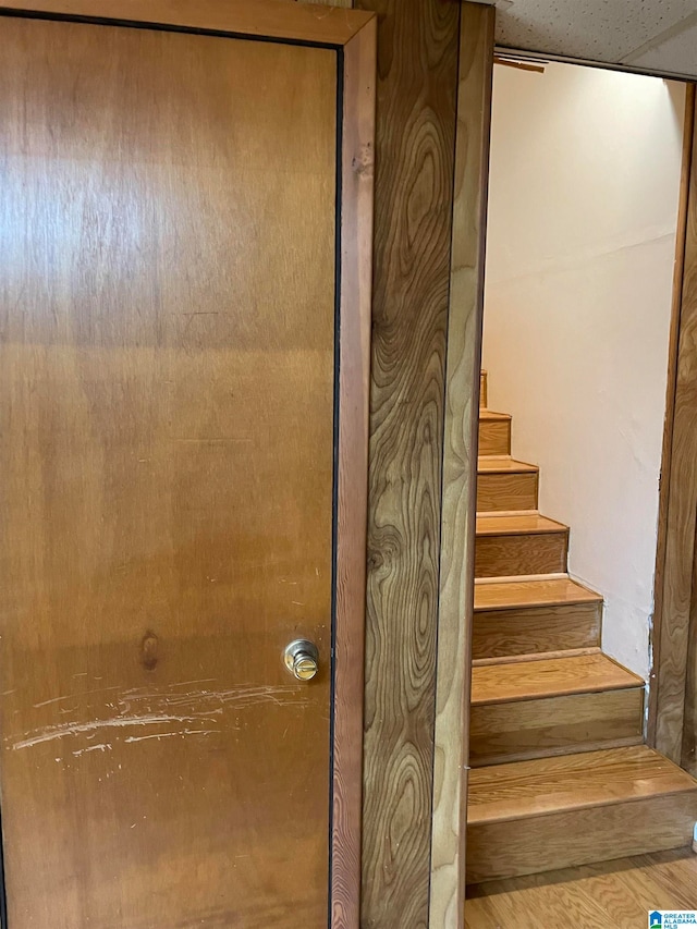 staircase featuring hardwood / wood-style floors