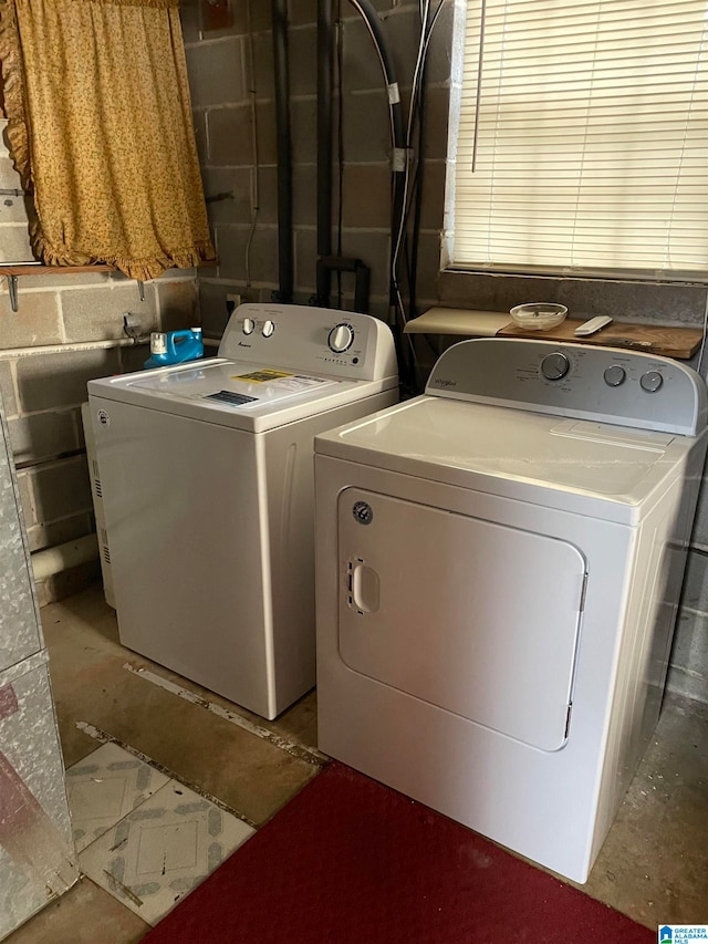 washroom with washing machine and dryer