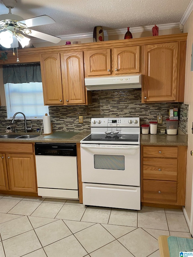 kitchen featuring light tile patterned flooring, crown molding, backsplash, sink, and white appliances