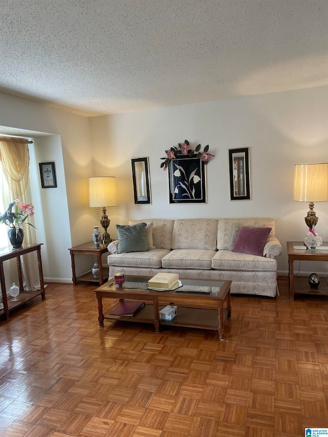 living room with a textured ceiling