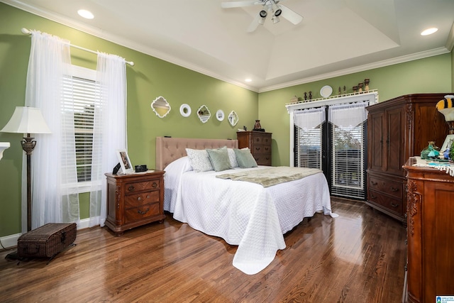 bedroom featuring ceiling fan, dark hardwood / wood-style floors, a tray ceiling, crown molding, and access to outside