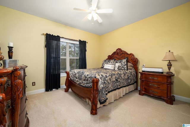 bedroom featuring light colored carpet and ceiling fan