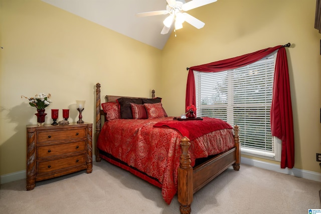 carpeted bedroom featuring ceiling fan and vaulted ceiling