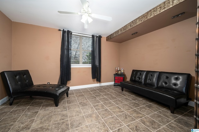 living area featuring ceiling fan