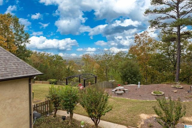 view of yard with a fire pit, a pergola, and a patio