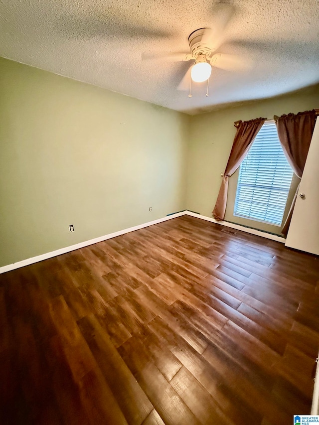 unfurnished room with hardwood / wood-style floors, ceiling fan, and a textured ceiling