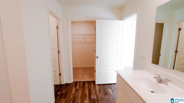 bathroom with vanity and hardwood / wood-style flooring