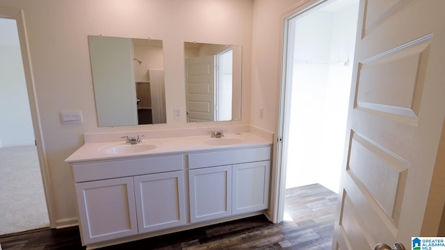 bathroom with vanity and wood-type flooring