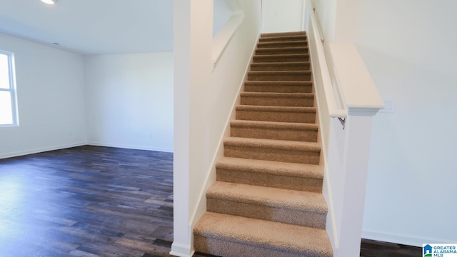 staircase featuring hardwood / wood-style flooring