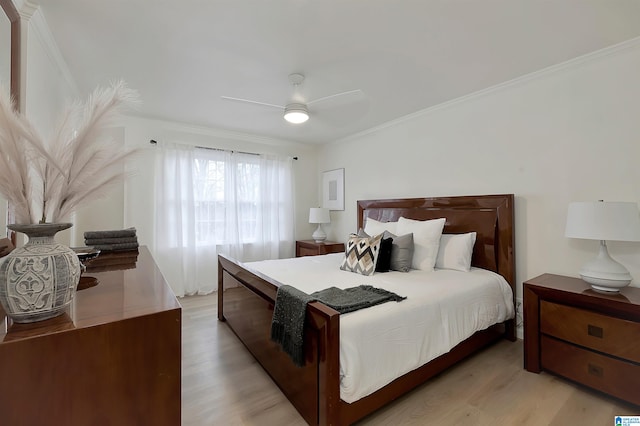 bedroom featuring light wood-type flooring, ceiling fan, and crown molding