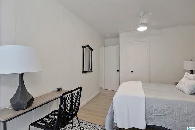 bedroom with ceiling fan and light hardwood / wood-style flooring