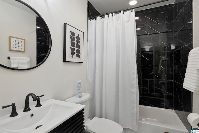 full bathroom featuring vanity, toilet, and shower / bath combination with curtain