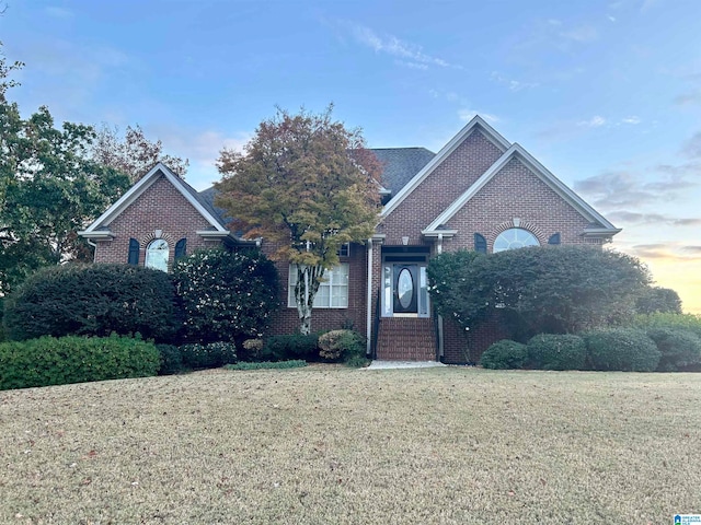 view of front of home with a yard