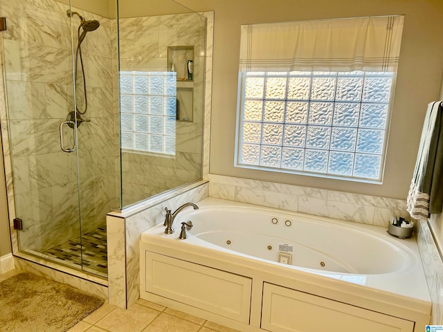 bathroom featuring plus walk in shower and tile patterned floors