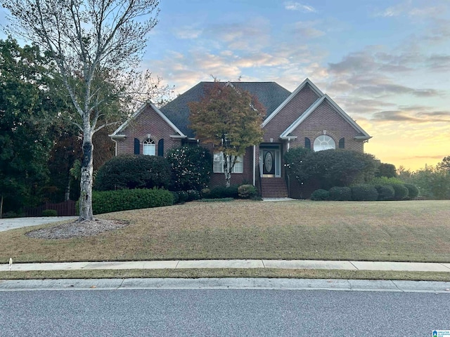 view of front of home with a yard