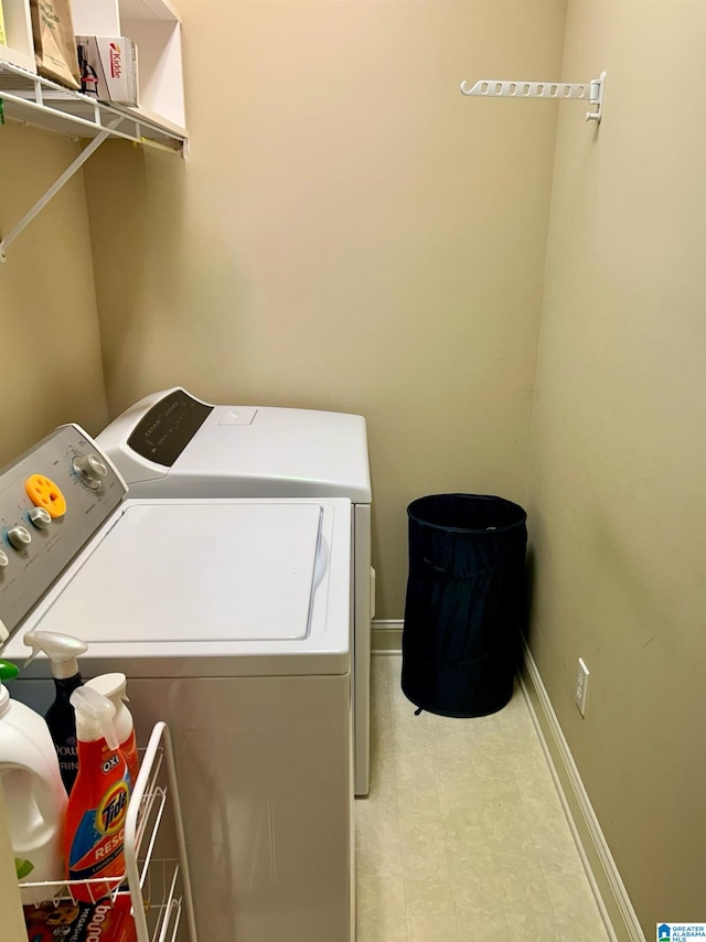 clothes washing area featuring washer and clothes dryer