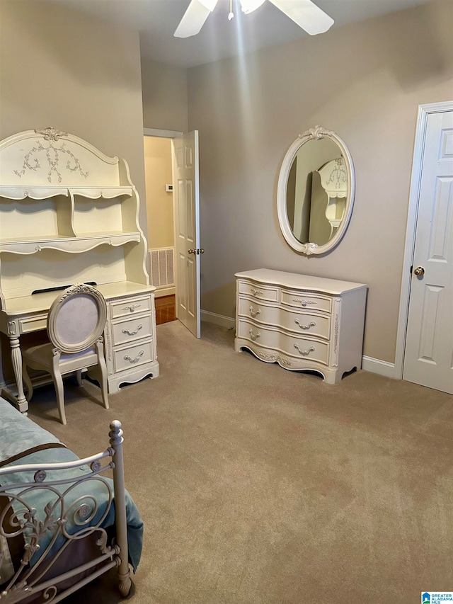 bedroom featuring light carpet and ceiling fan