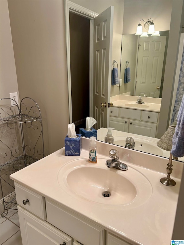 bathroom with vanity and tile patterned flooring