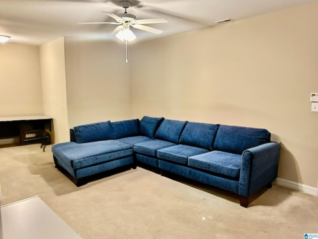 living room featuring light colored carpet and ceiling fan