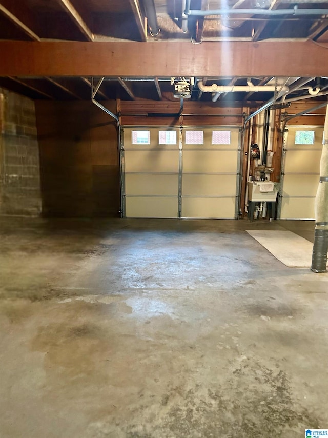 garage with a garage door opener and sink