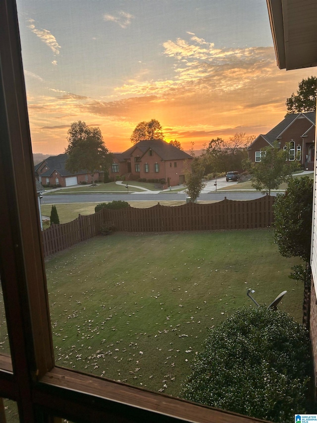 view of yard at dusk