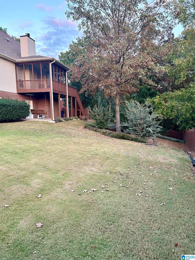 view of yard featuring a sunroom