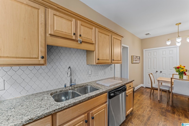 kitchen with decorative backsplash, sink, dishwasher, dark hardwood / wood-style floors, and hanging light fixtures